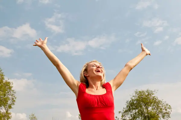 Woman raising her arms